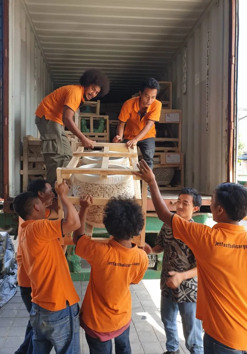 Jetfast Bali Cargo team loading household goods into a shipping container in Bali